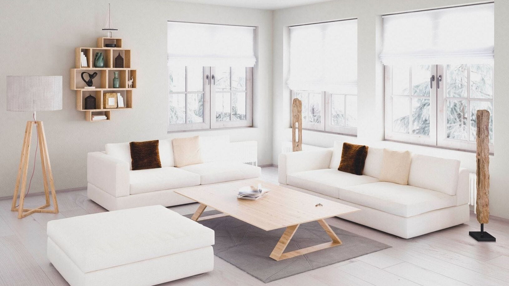 Tastefully decorated living room with a white couch, loveseat and ottoman.