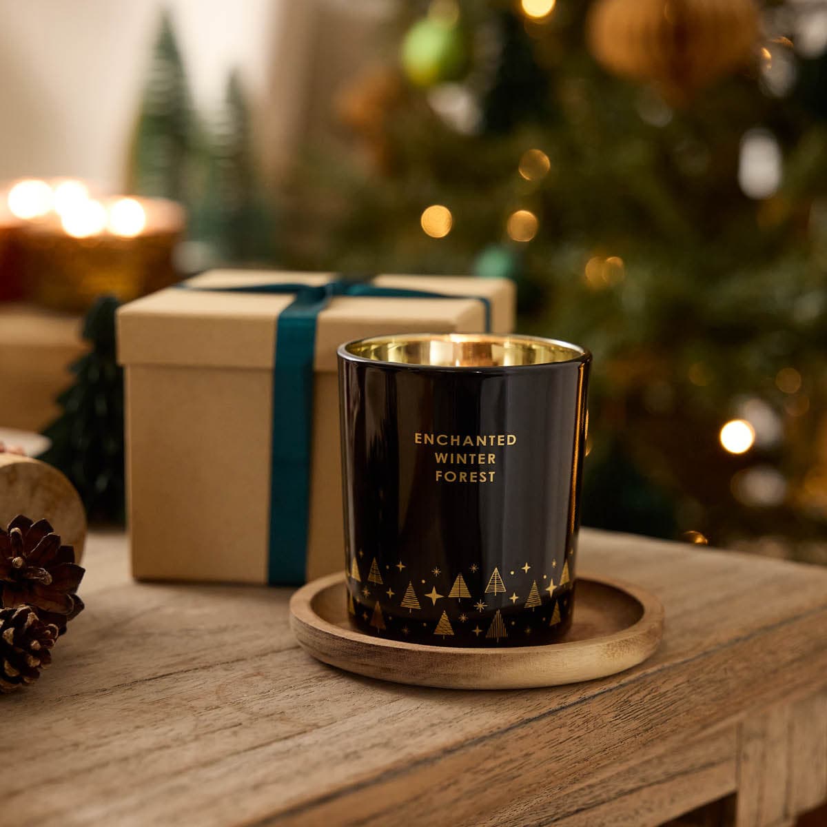 Enchanted Winter Forest Jar - Winter Nights metallic glass jar with decorative gold Christmas Trees across the bottom.