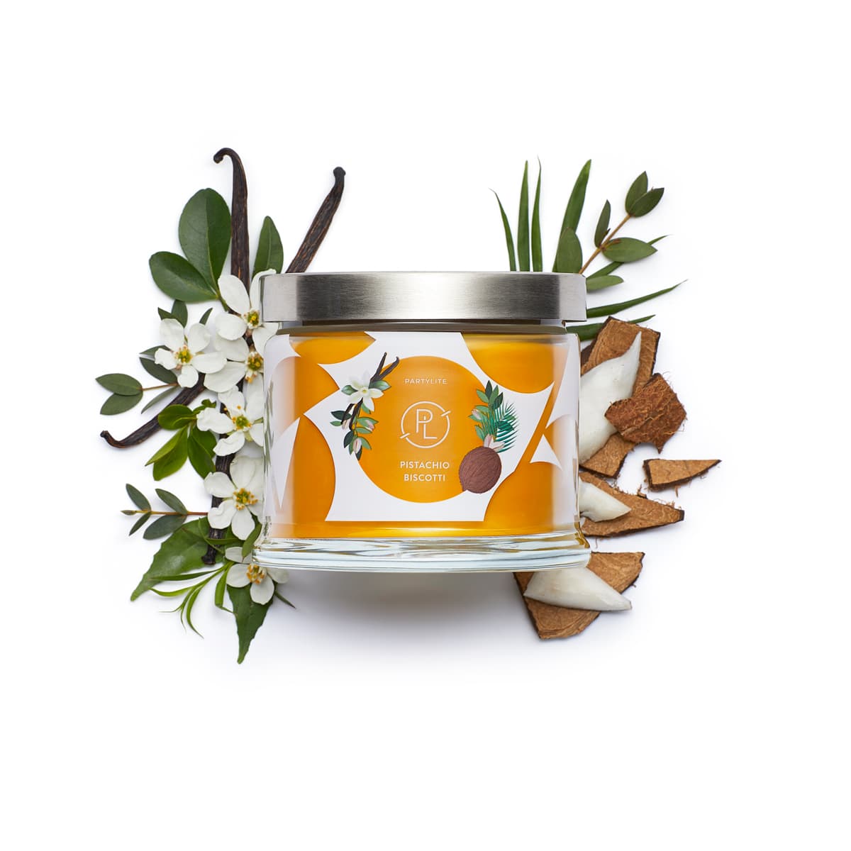 Pistachio Biscotti 3-wick Jar Candle surrounded by flowers and leaves against a white background.