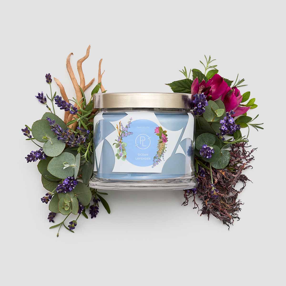 Ocean Lavender 3-wick Jar Candle with flowers and leaves surrounding against a white background.