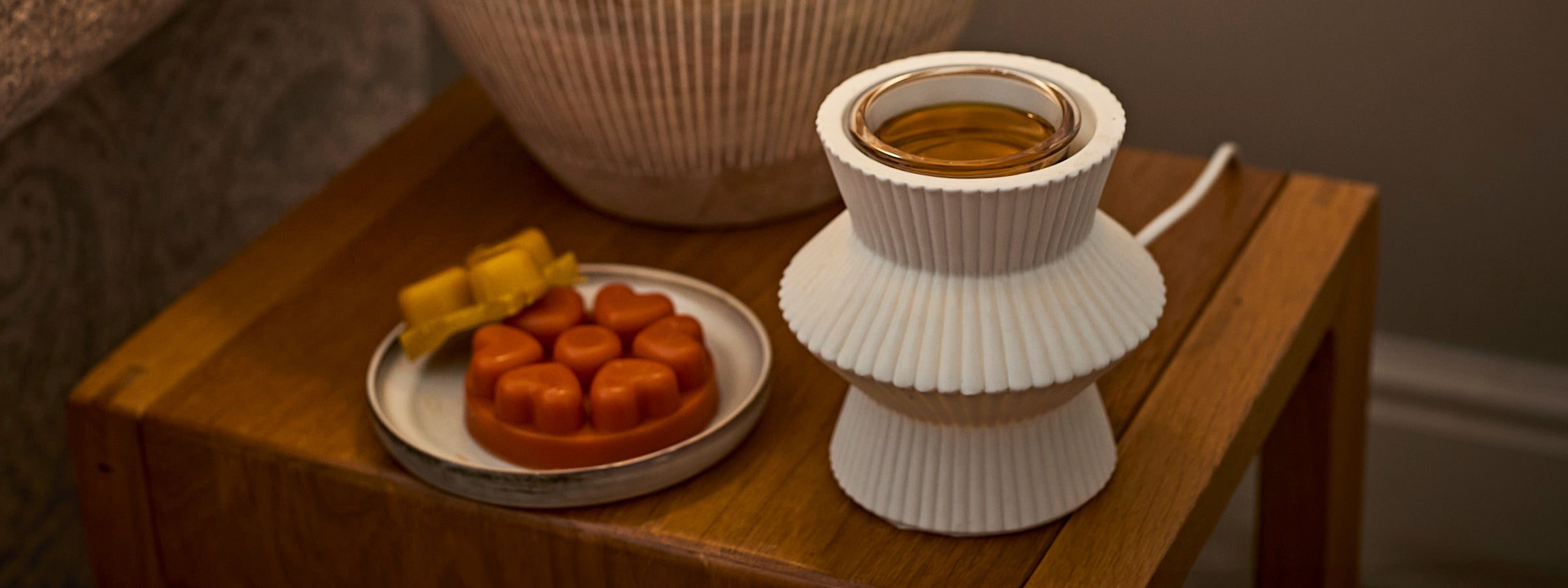 Wax melt warmer and melts on a side table