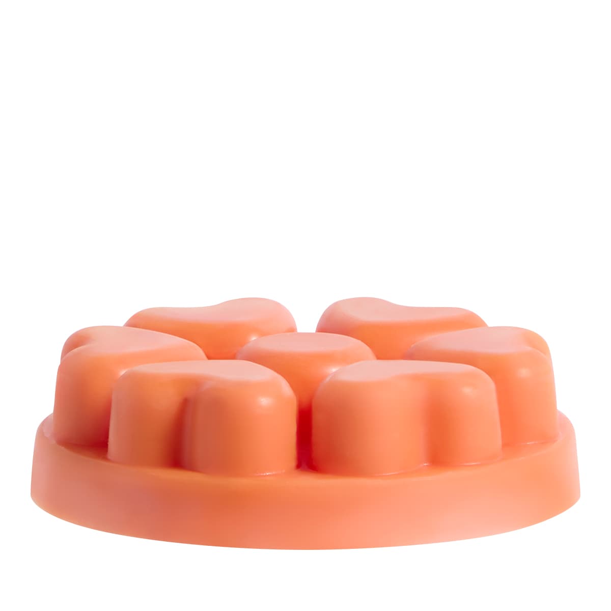 Spiced Pumpkin heart shaped wax melts in an orange color against a white background.