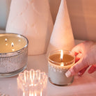 Winter Morning Mini Jar Candle lit shown with a lit Ripple jar candle.